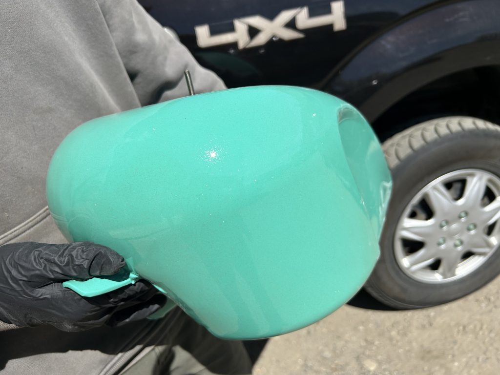 custom seafoam green powder coating on a motorcycle gas tank