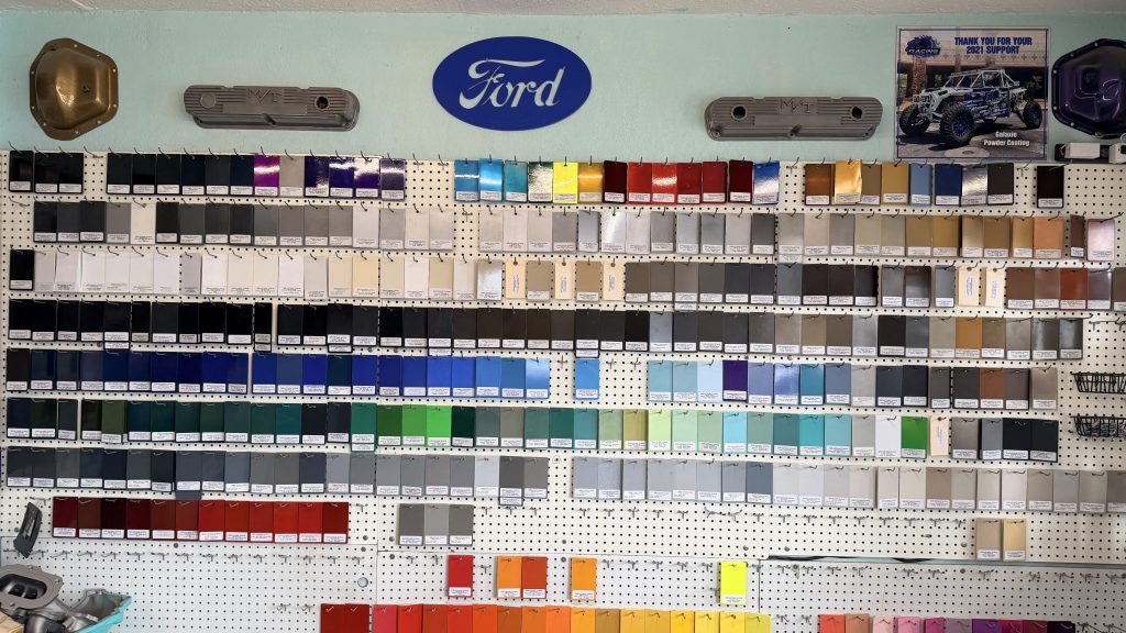 the wall of powder coating swatches hanging in galaxie shop
